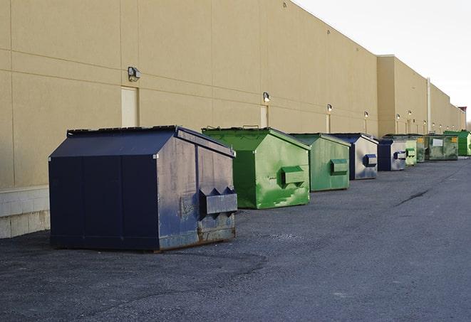 a crowd of dumpsters of all colors and sizes at a construction site in Ardmore AL